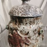 Ceramic pot decorated with bulls in relief
