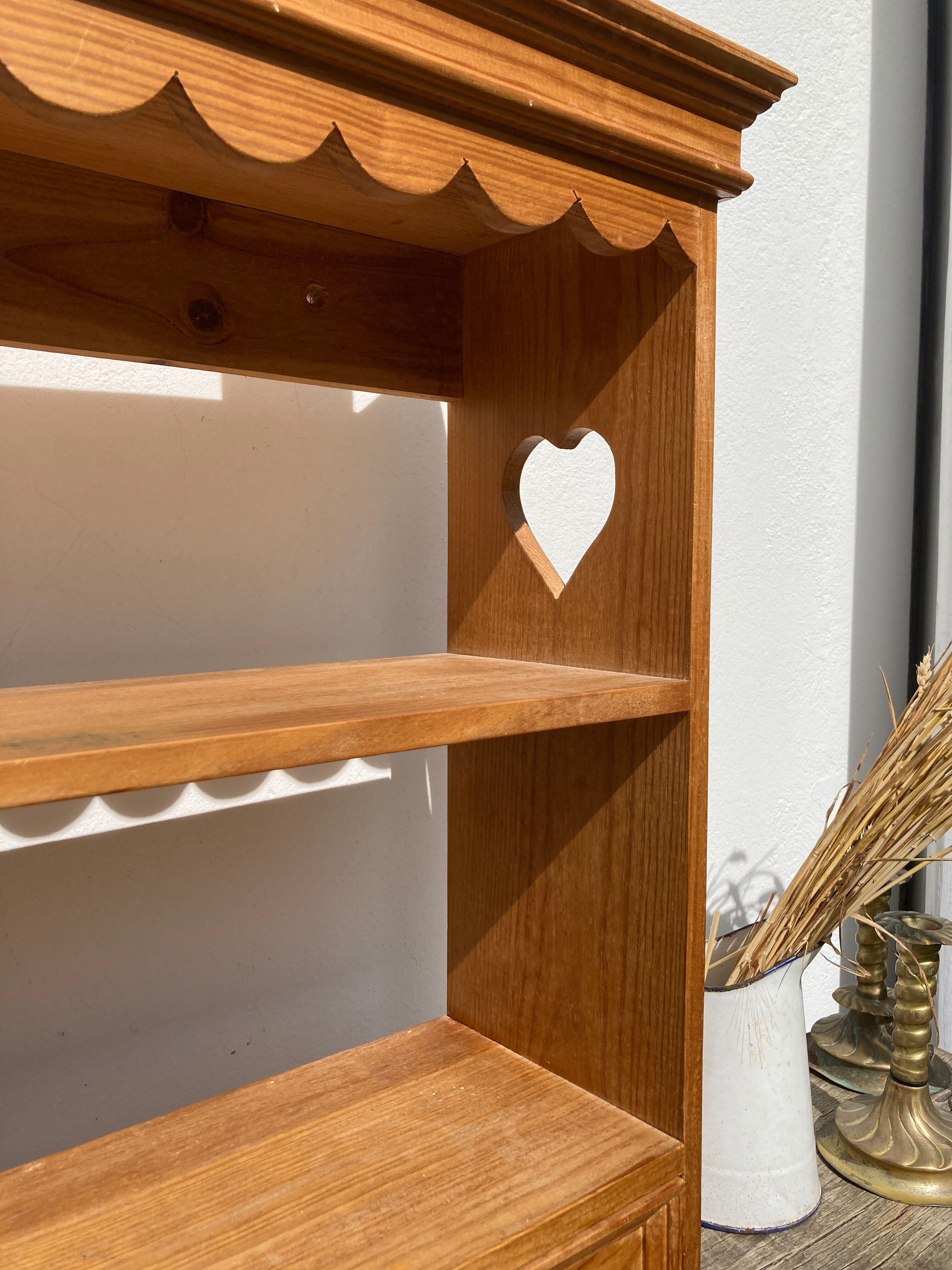 Wall shelf in raw wood with drawers and openwork hearts