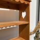 Wall shelf in raw wood with drawers and openwork hearts