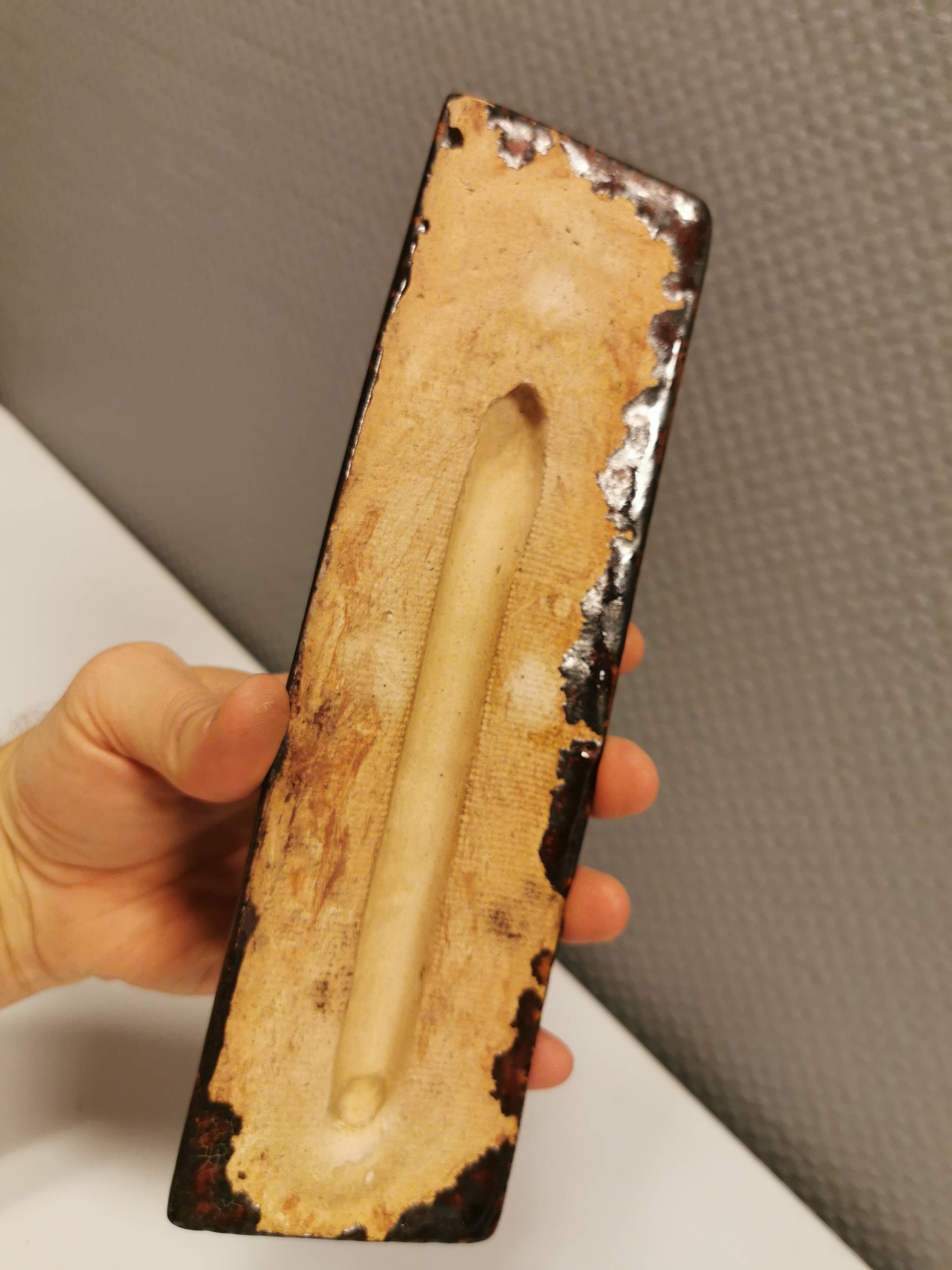 Slim relief with a motif of Madonna and child.