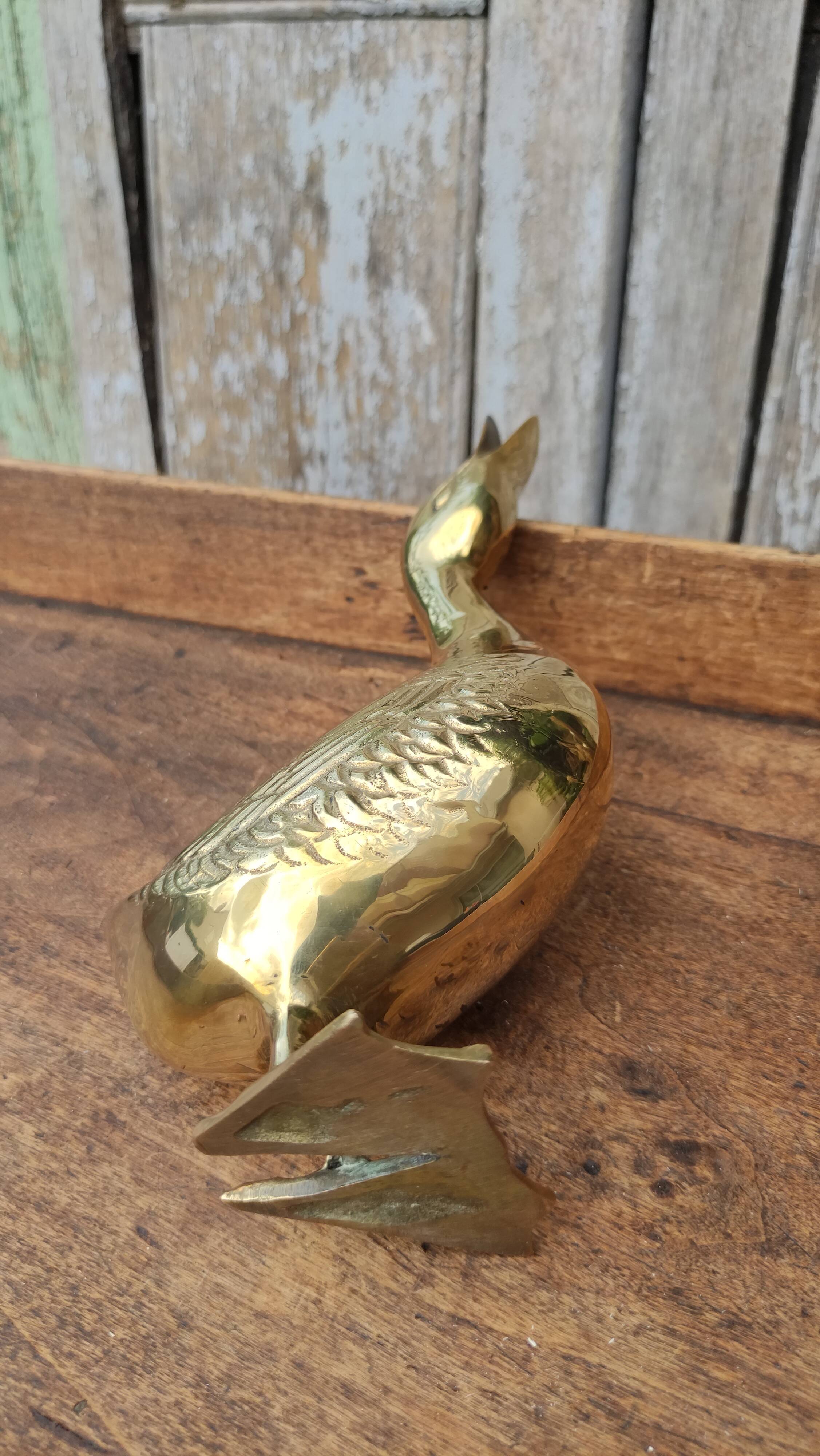 Large vintage duck in golden brass