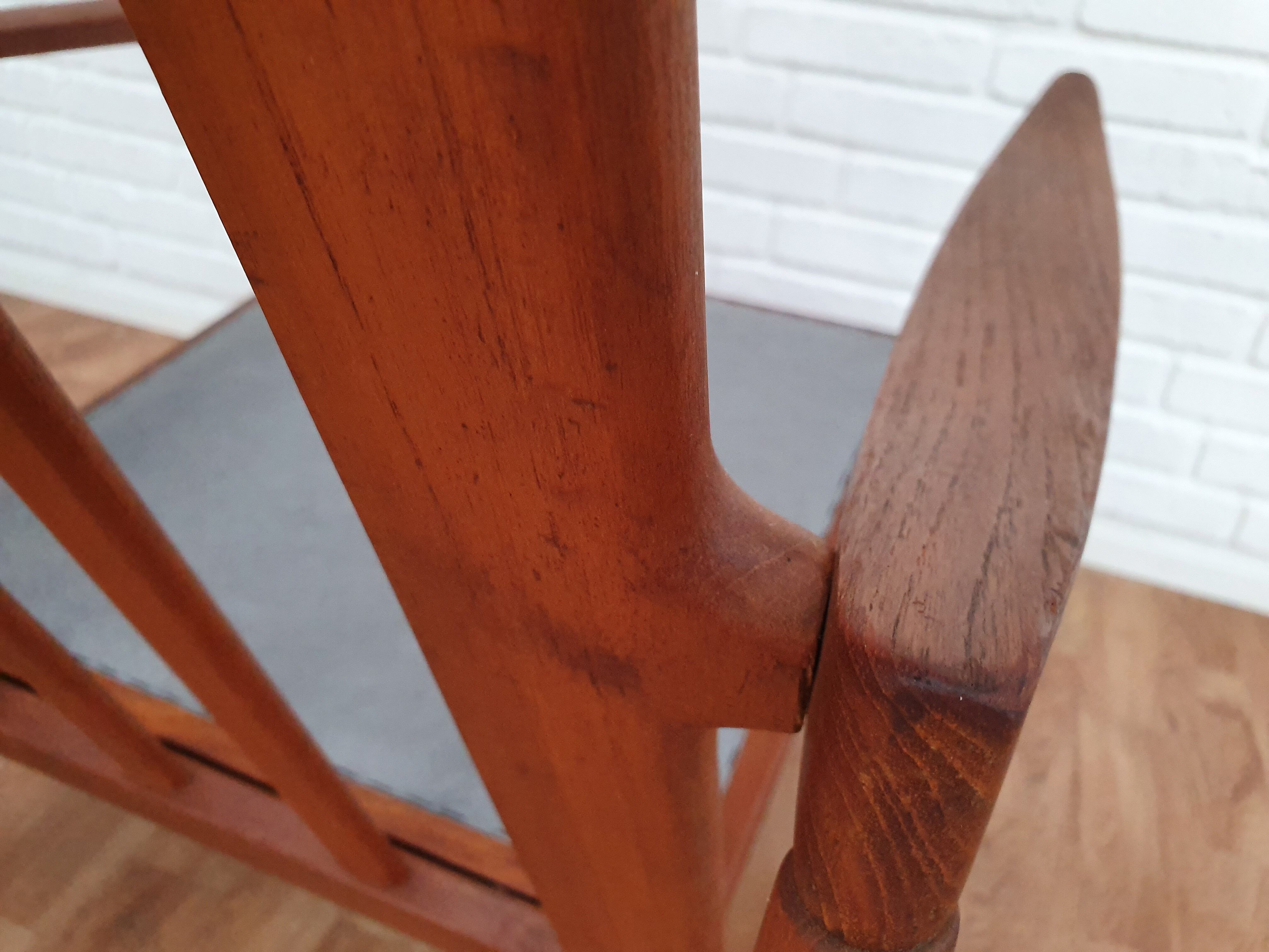 A pair of Danish armchairs, teak, wool, leather