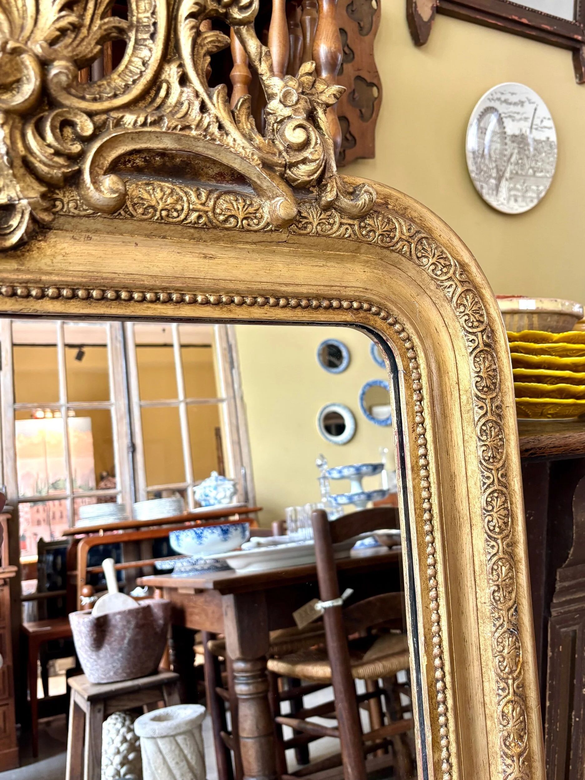 Gold sculpted and moulded stucco trumeau mirror 113 x 78 cm