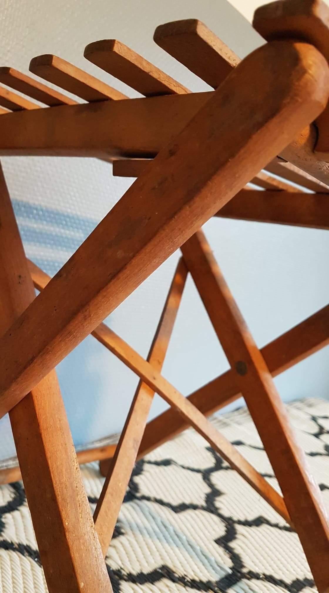 Old foldable stool in tinted wood