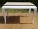 Oak coffee table with curved legs.