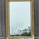 Large Louis Philippe mirror in carved gilded wood with mercury glass.