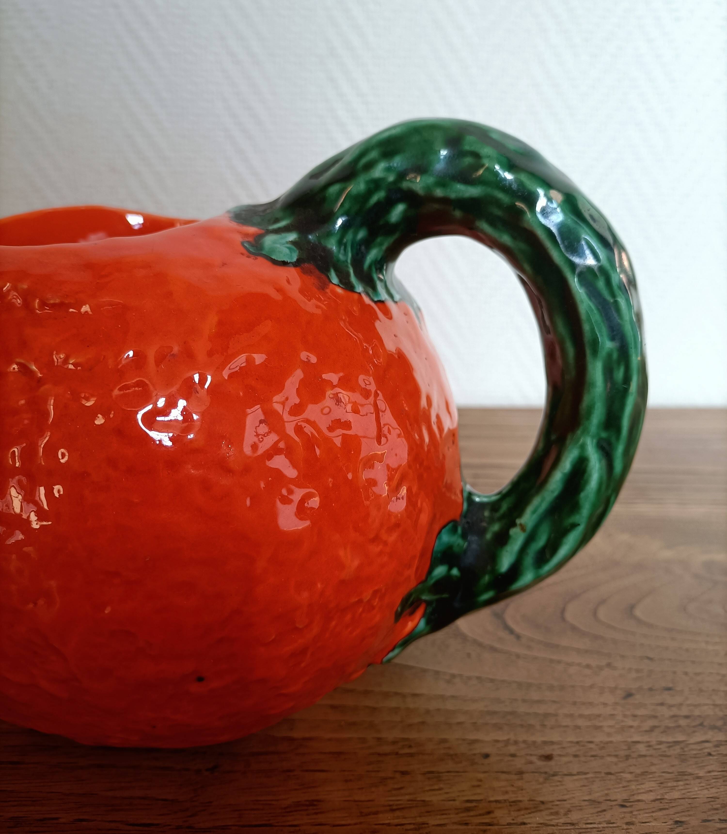Orange pitcher in Corsican slip