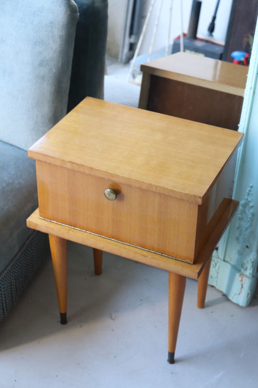 Modernist bedside table from the 1950s with compass legs.