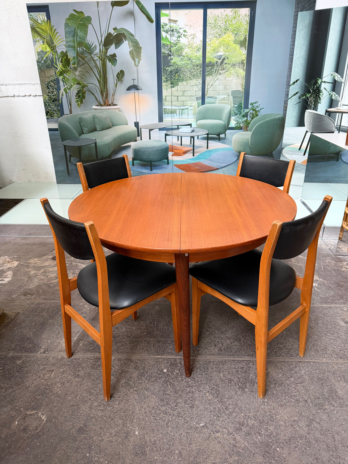 4 Scandinavian chairs in teak and black faux leather.