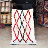 Small vintage beni ouarain rug