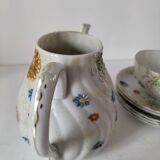 coffee pot, cup and saucers
