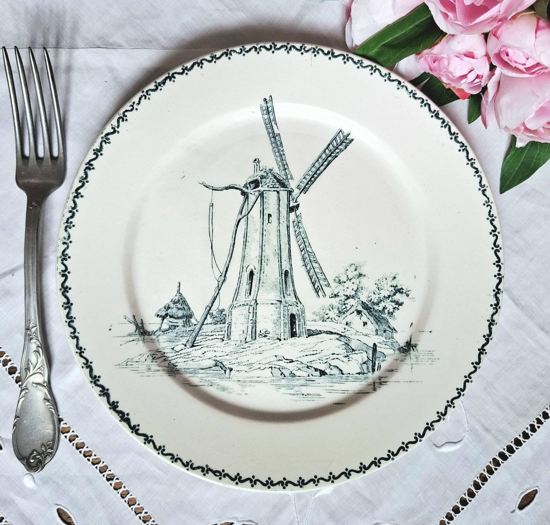 Old mismatched flat plates made of ironstone earthenware.