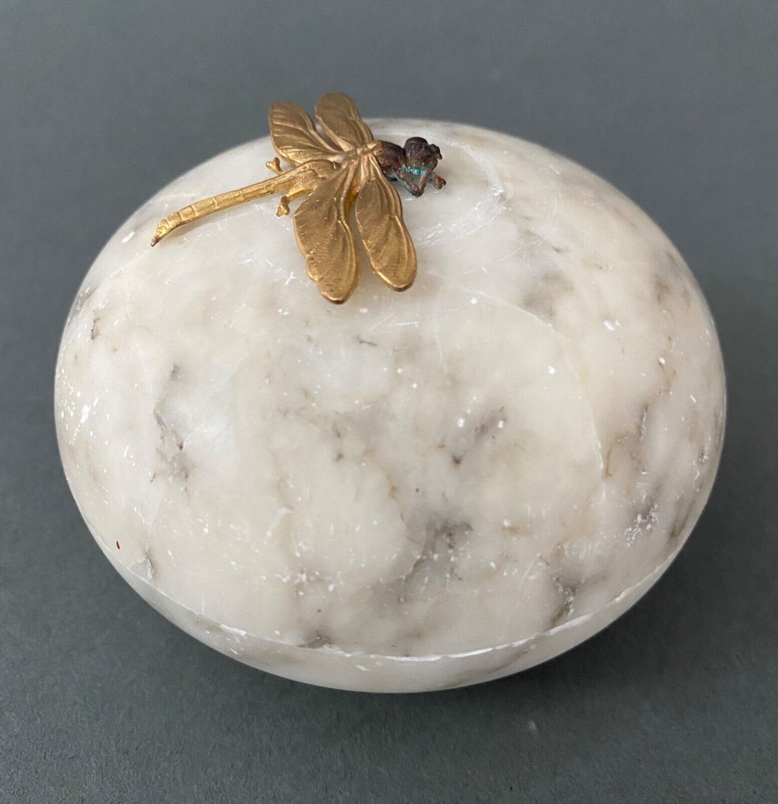 1900 alabaster ball shaped box surmounted by a golden dragonfly