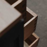 Black and natural wood chest of drawers with 4 drawers