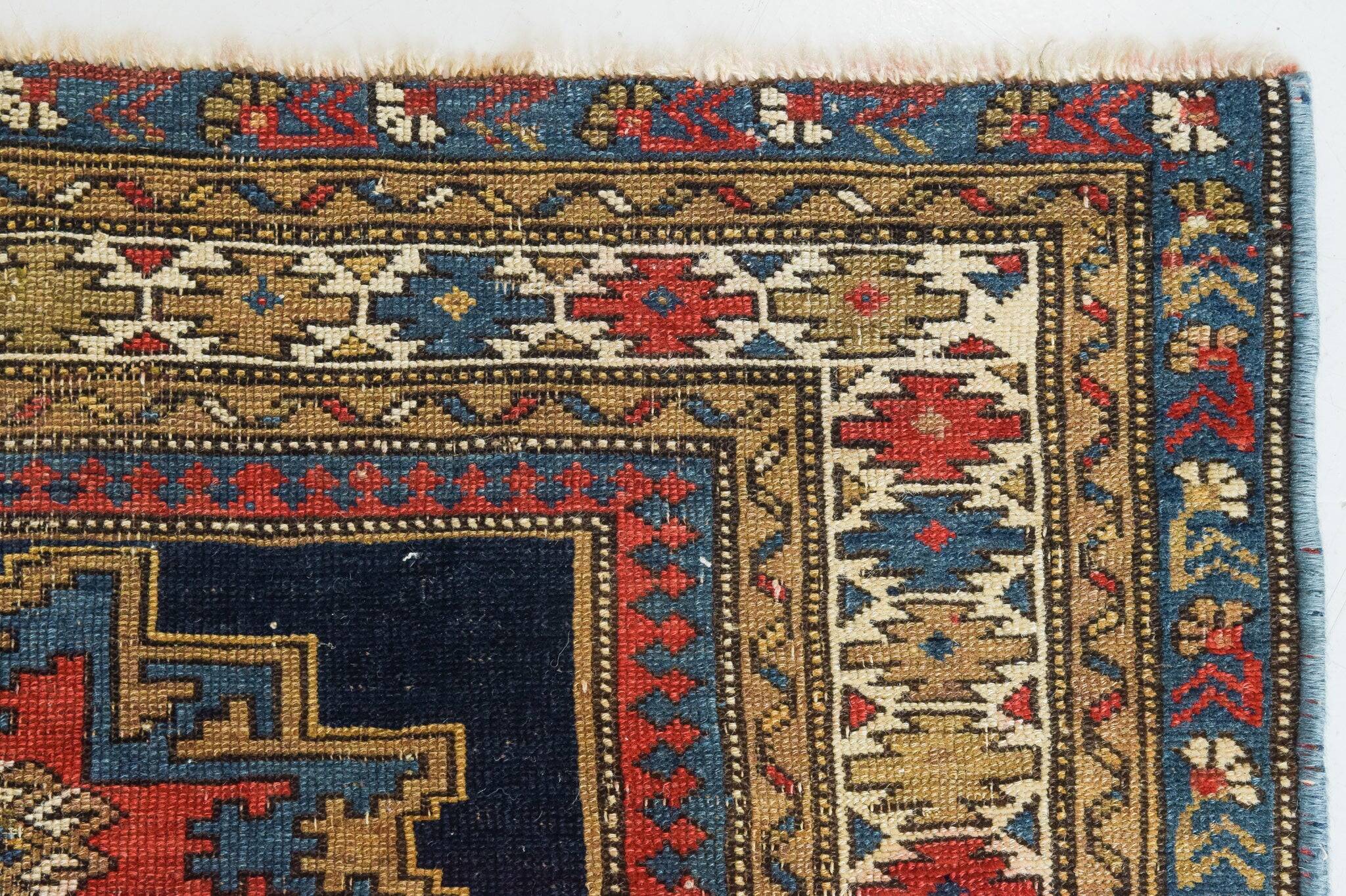 Handwoven Antique - Blue Ground Persian Rug with Bird-like Figures