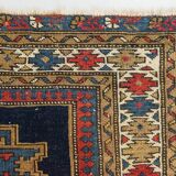 Antique tissé à la main - Tapis persan à fond bleu avec des figures ressemblant à des oiseaux