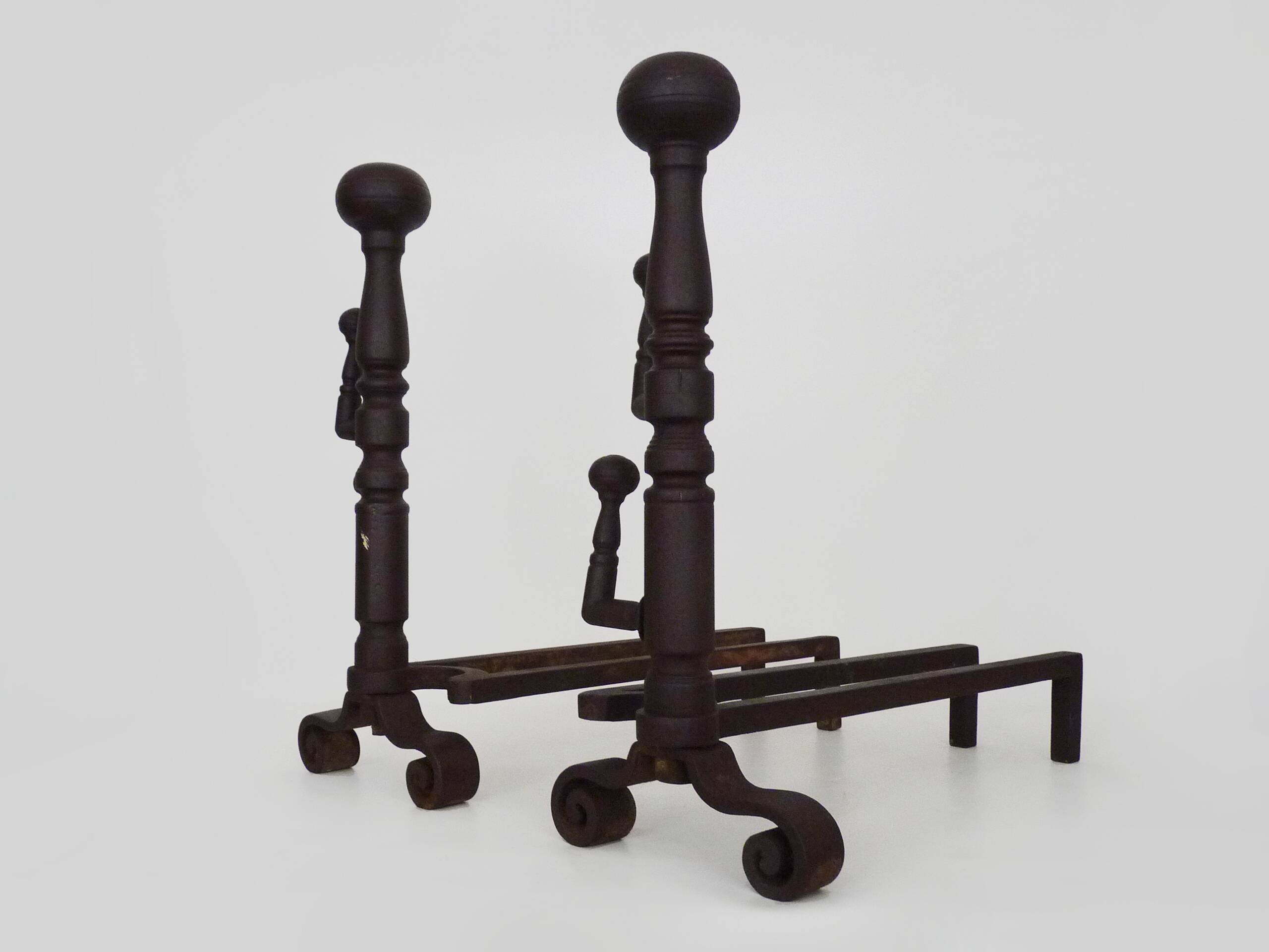 Large pair of wrought iron fireplace andirons. France, 19th century.