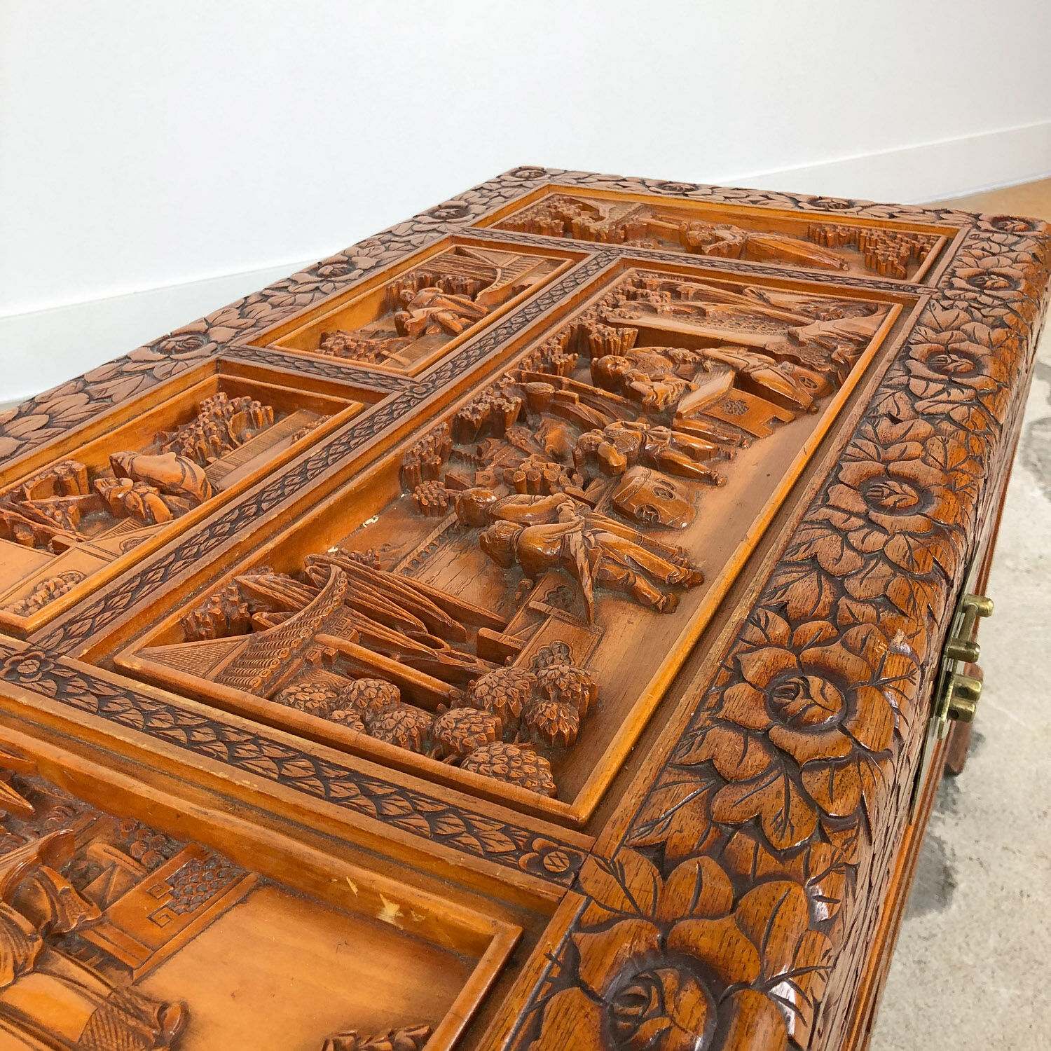 Vintage Chinese carved camphor wood chest on claw feet