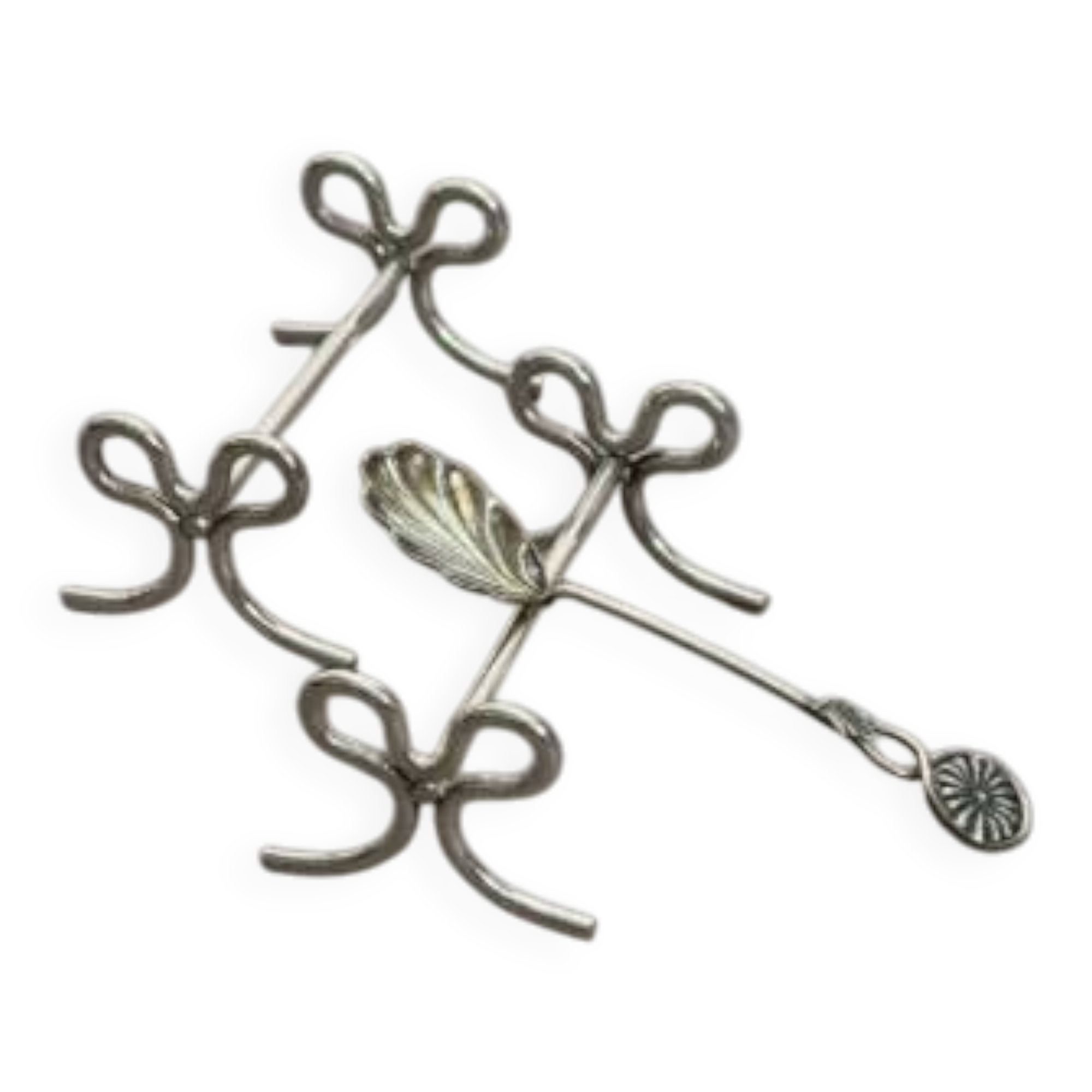 Set of six silver-plated ribbon-shaped knife rests. 20th century