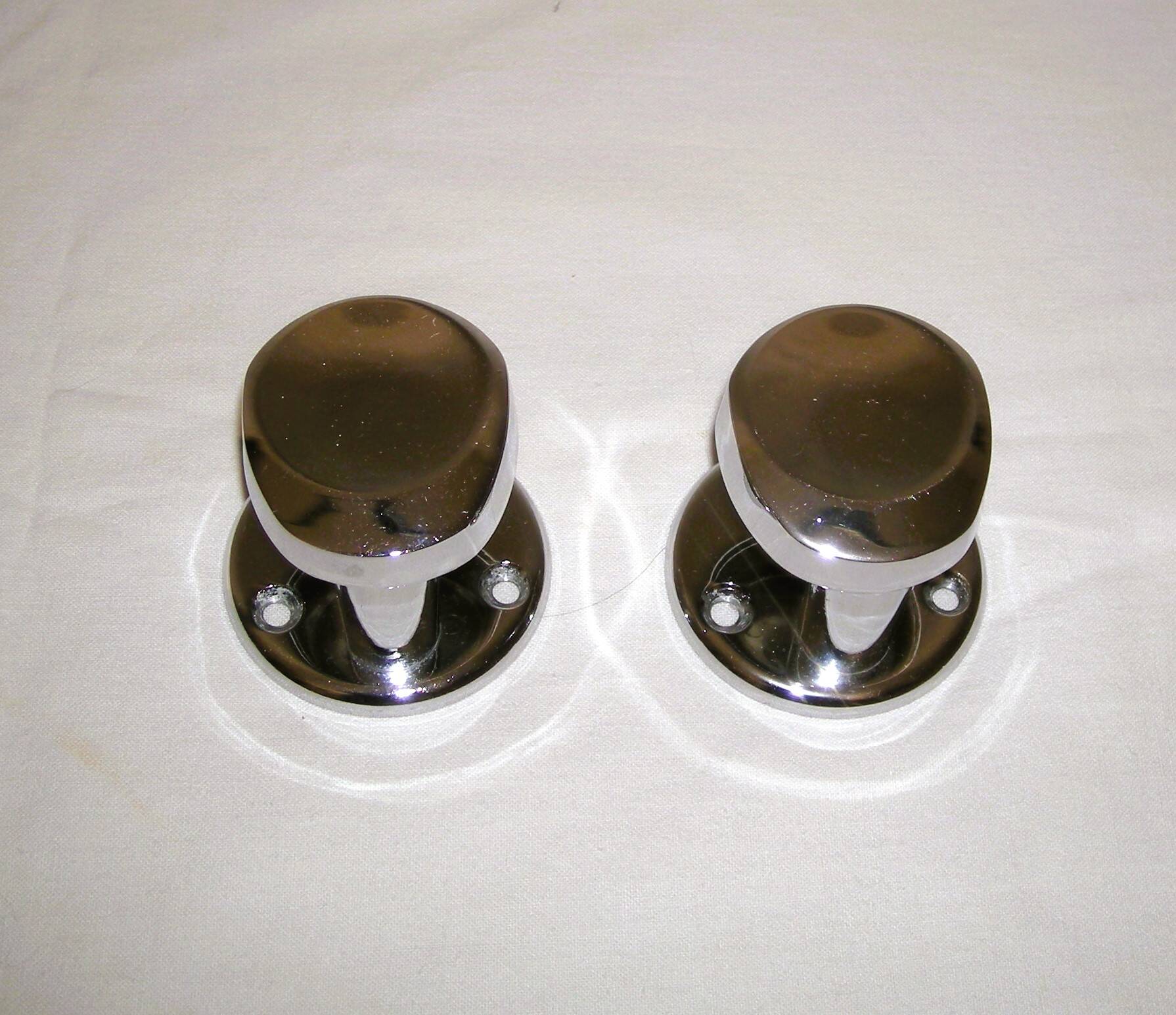 Pair of stainless steel coat racks from the 1970s.