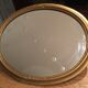 Miroir ovale en bois doré 67x47cm