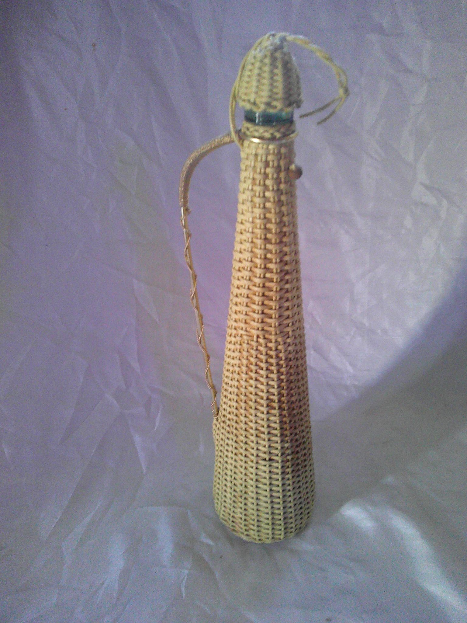 Old glass bottle - Woven wicker