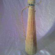 Old glass bottle - Woven wicker