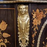 Boulle furniture with a curved shape from the Napoleonic III era in lacquered wood and marquetry.