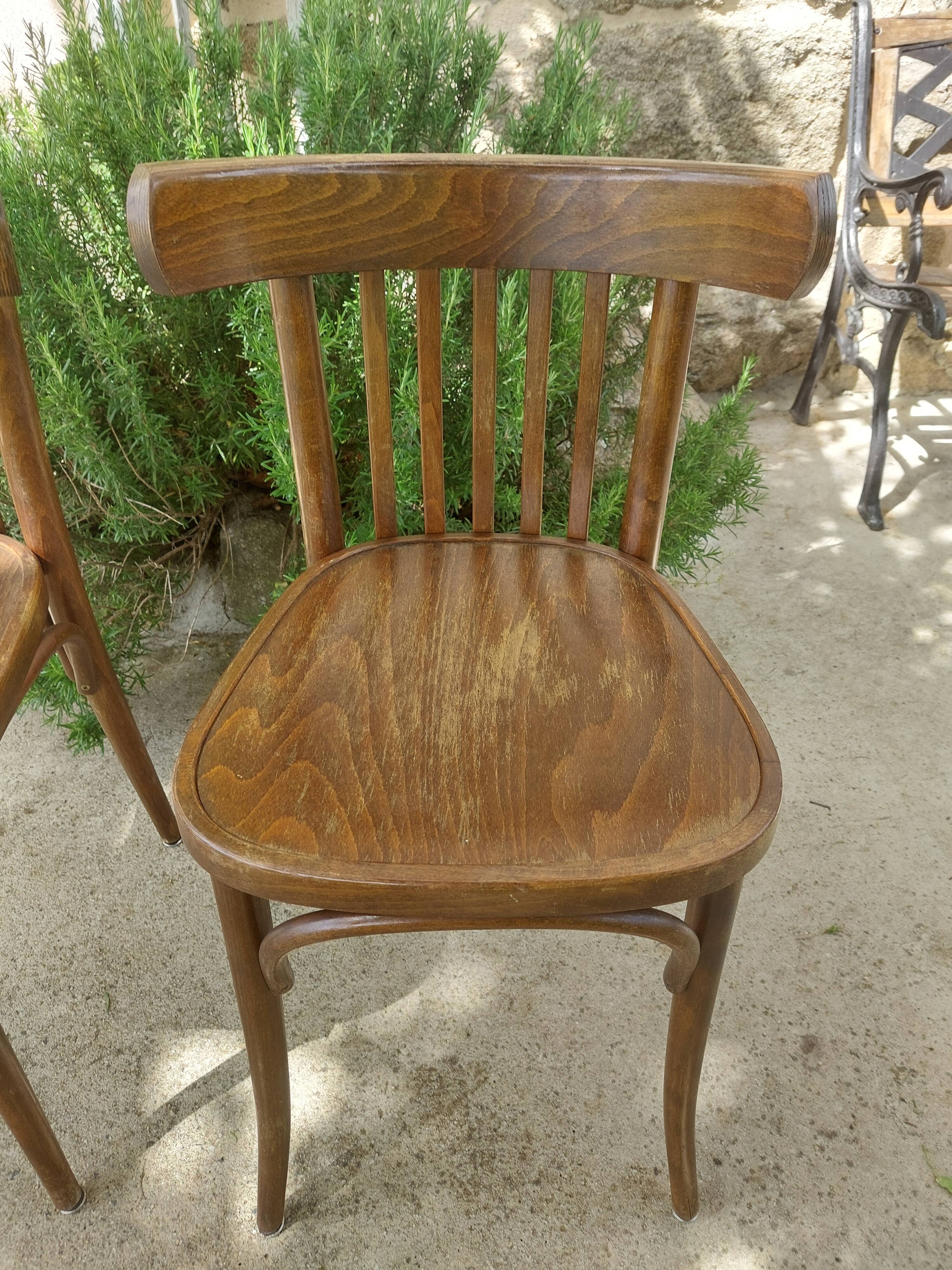 pair of dark bistro chairs, rounded backs, Baumann style
