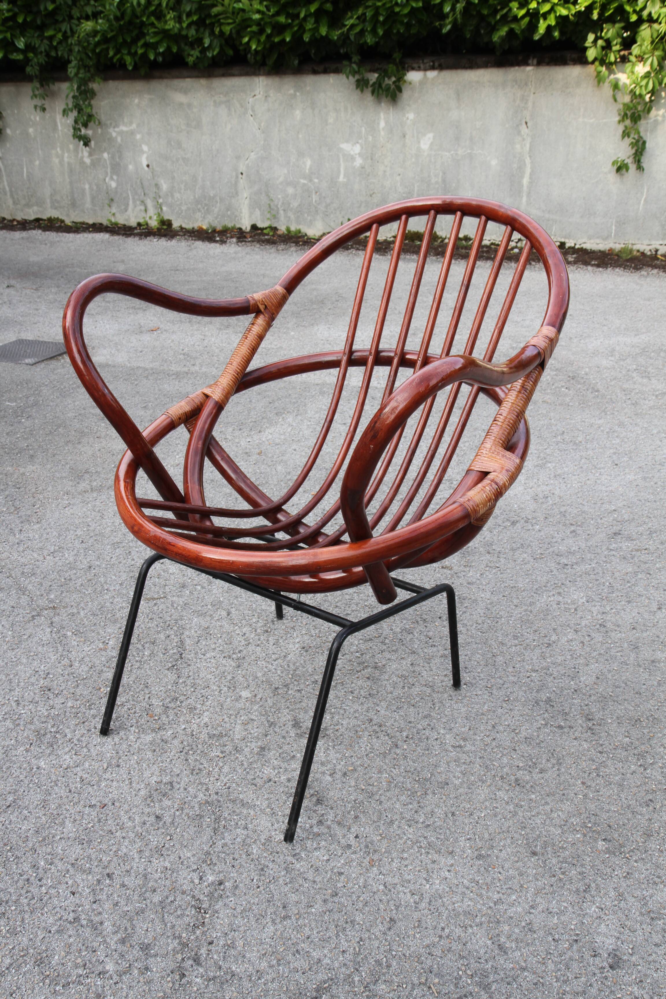 Rattan shell armchair with metal feet