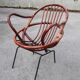 Rattan shell armchair with metal feet