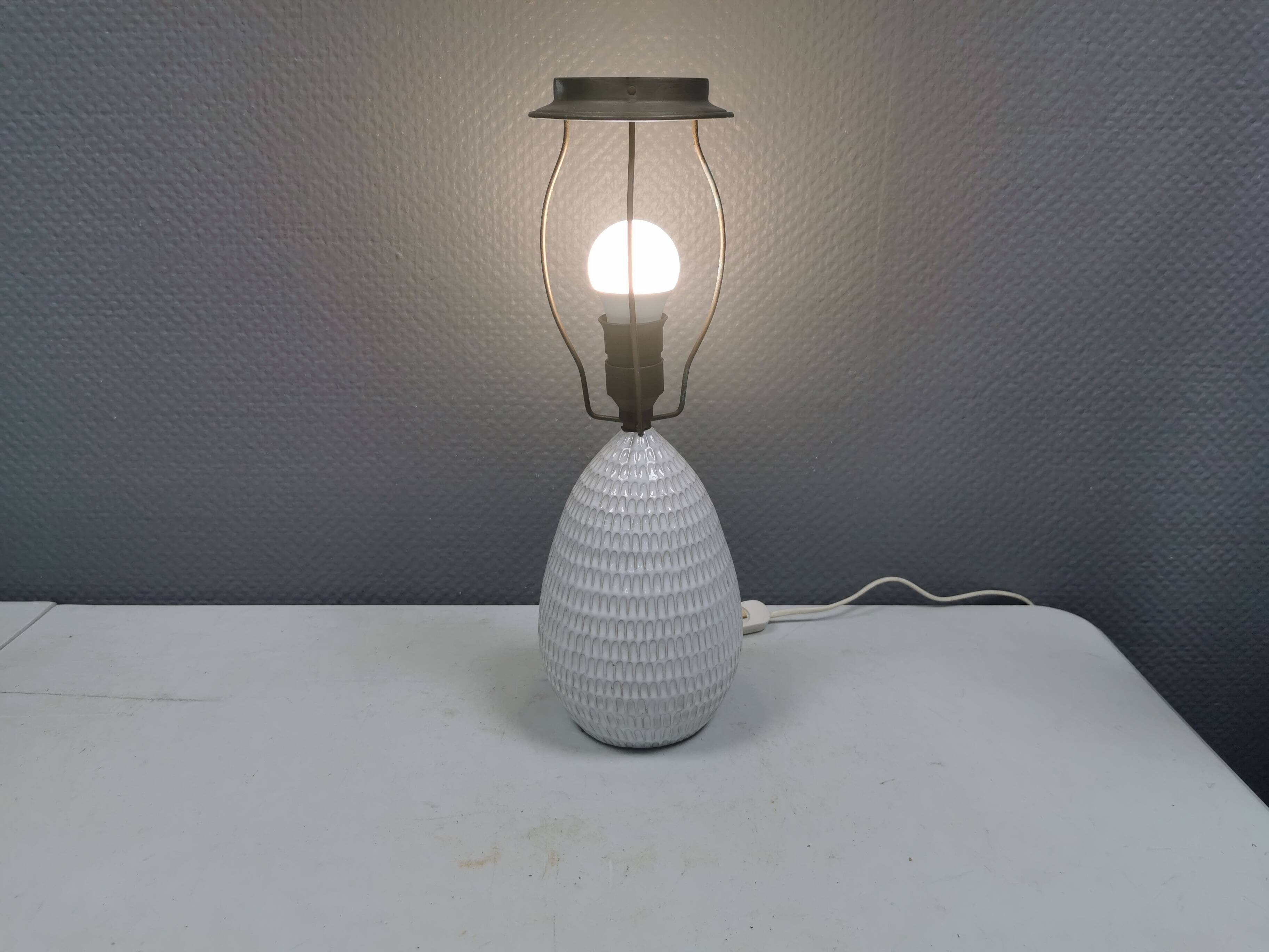 Older ceramic table lamp with beautiful details.