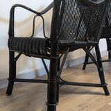 Paire de fauteuils noirs en rotin