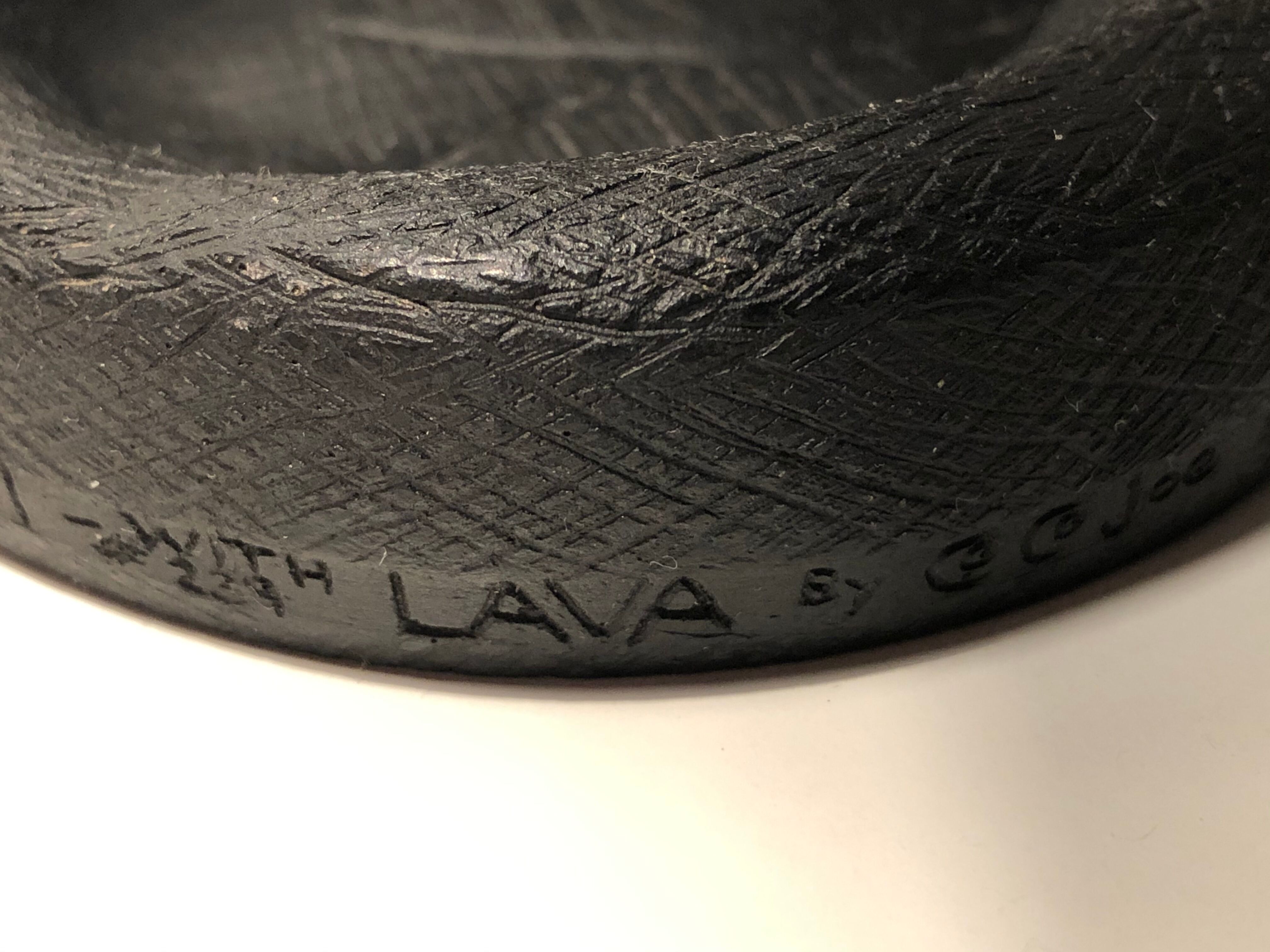 Empty pocket in Hawaiian lava in the shape of a hand signed Coco Joe, 1960