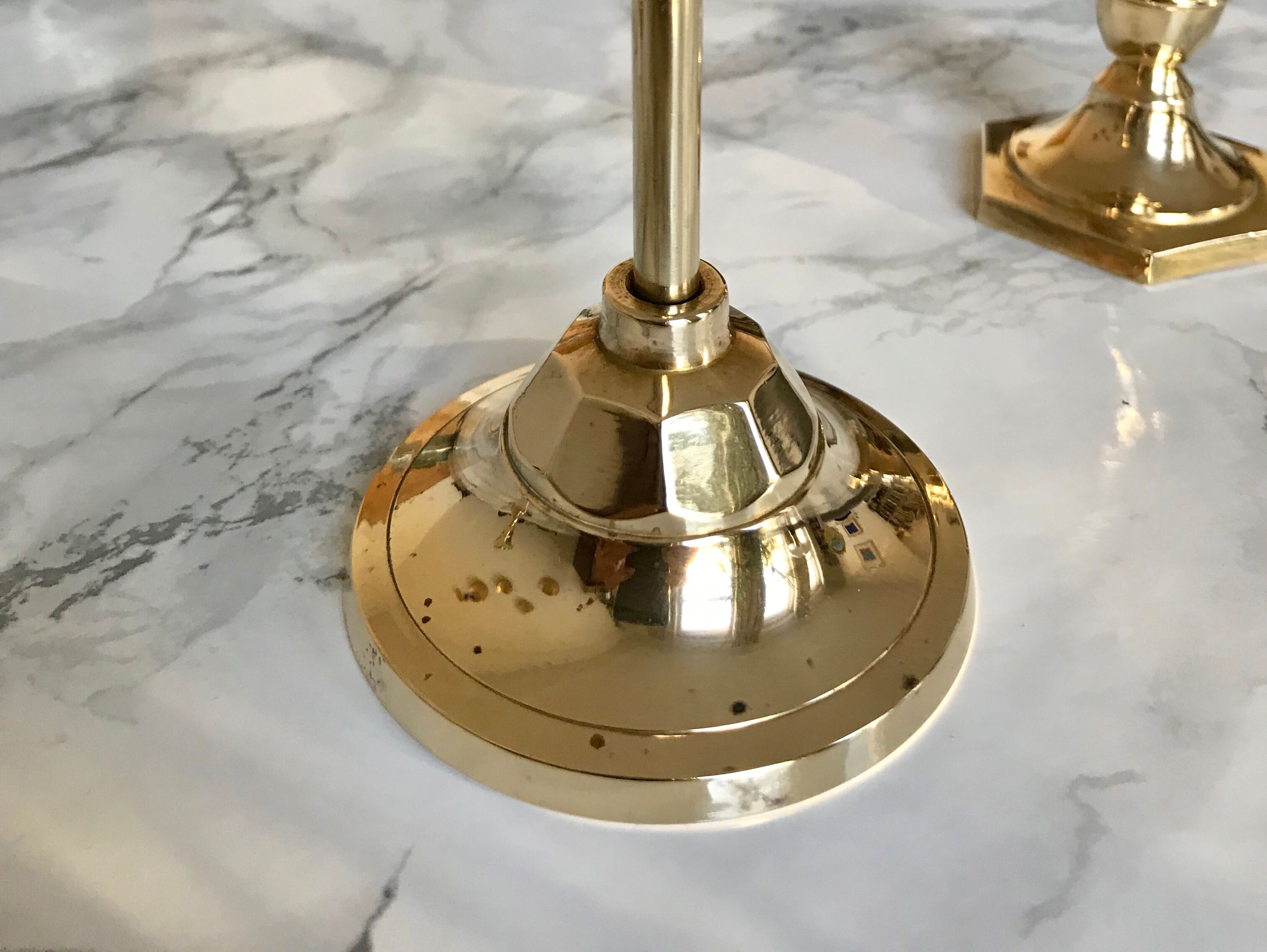 Set of three candlesticks in brass