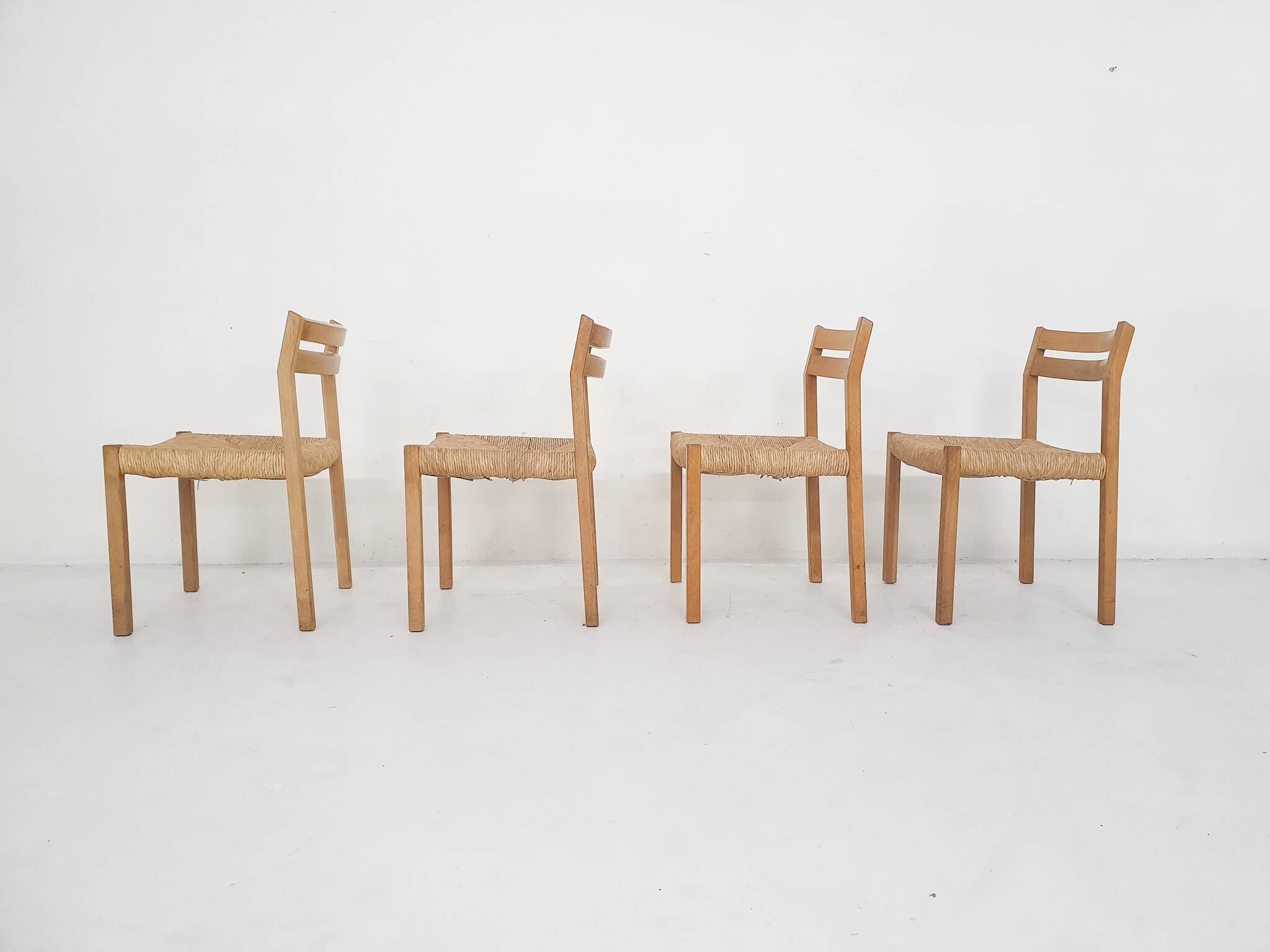 Set of four oak and sisal dining chairs model 401 by JL Moller, Denmark 1970's