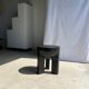 Black mango wood tripod side table with a semi-spherical top, height: 45 cm, diameter: 44 cm.