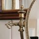 Oval mirror on psyche stand