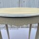 Eggshell-coloured drawer with a cracked effect side table.