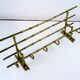 Bamboo-like coat rack in bronze