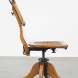 Antique late 19th century English office chair with reclining backrest and height adjustable