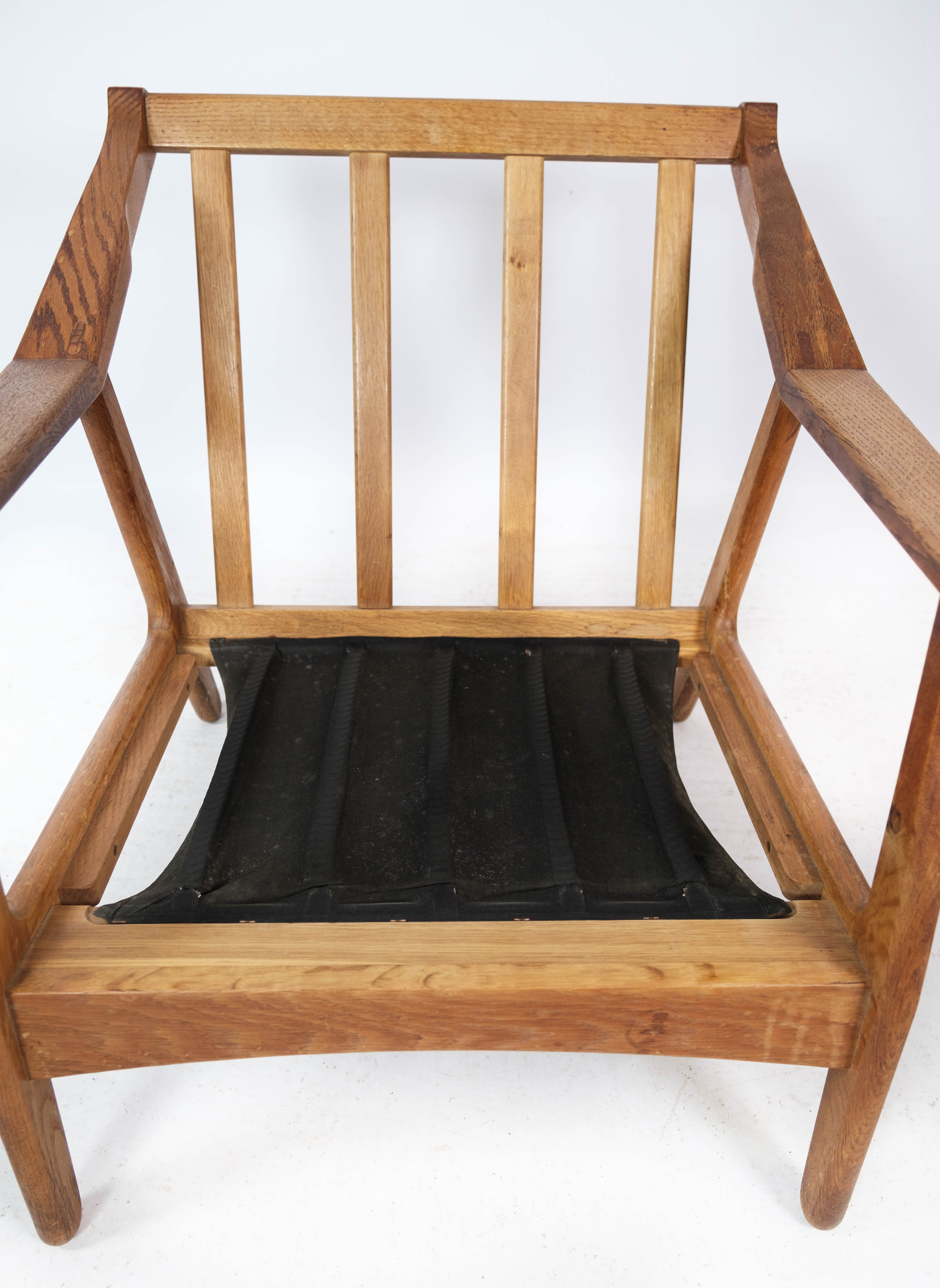 Armchair in oak and upholstered with red fabric, designed by H. Brockmann Pedersen, 1960s