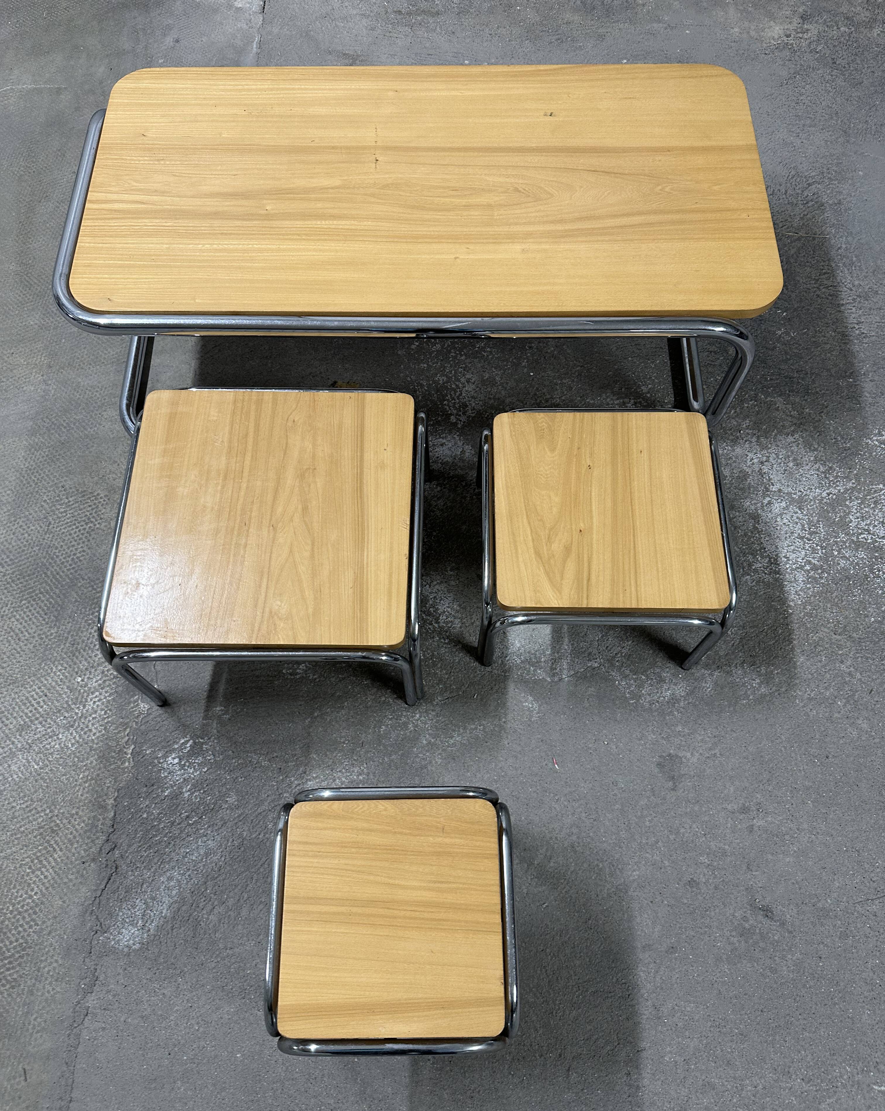 Set of 4 nesting coffee tables from the 70s, metal and solid oak.