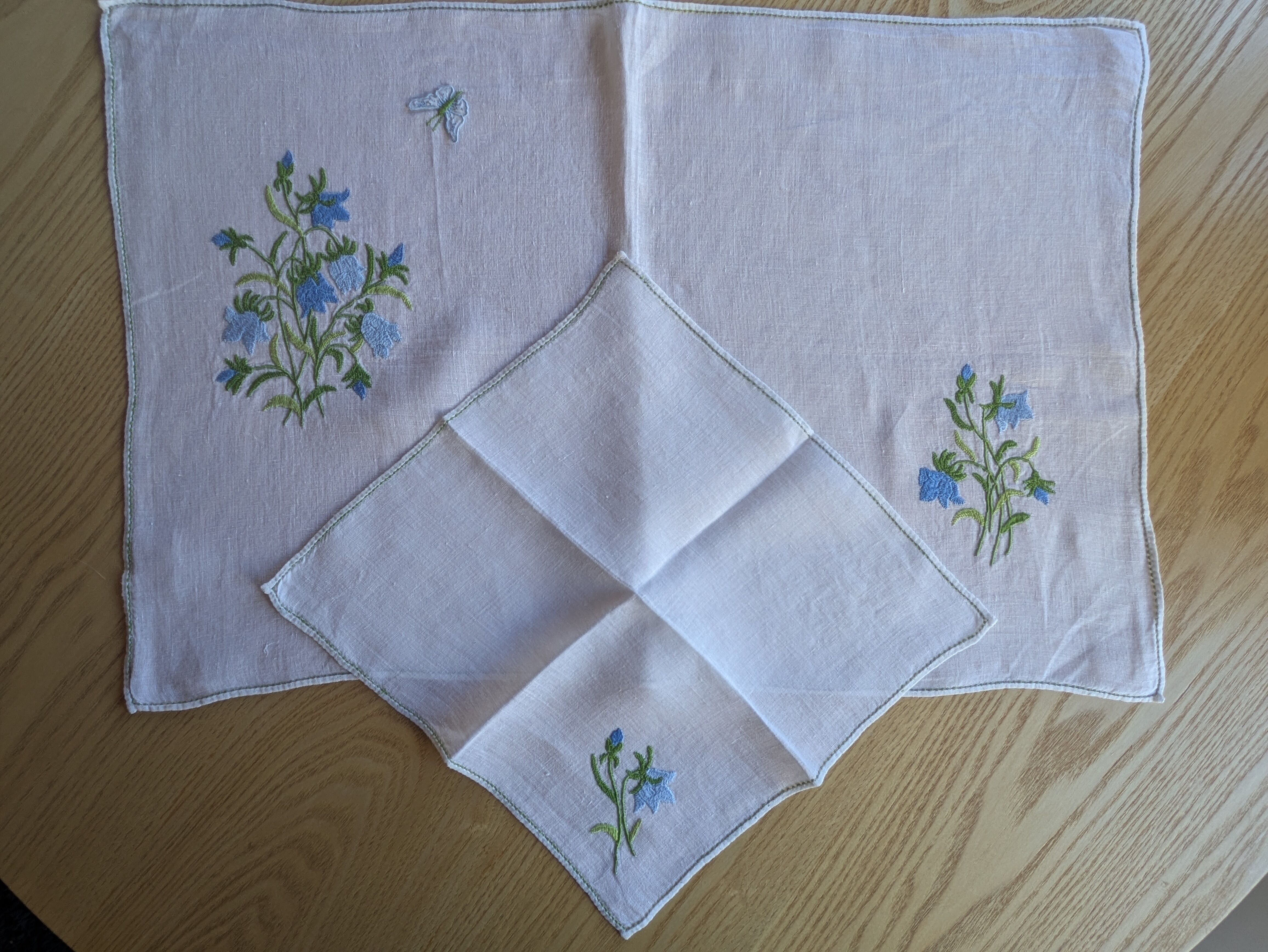 Hand-embroidered table duo in linen voile – Bluebells & Butterfly