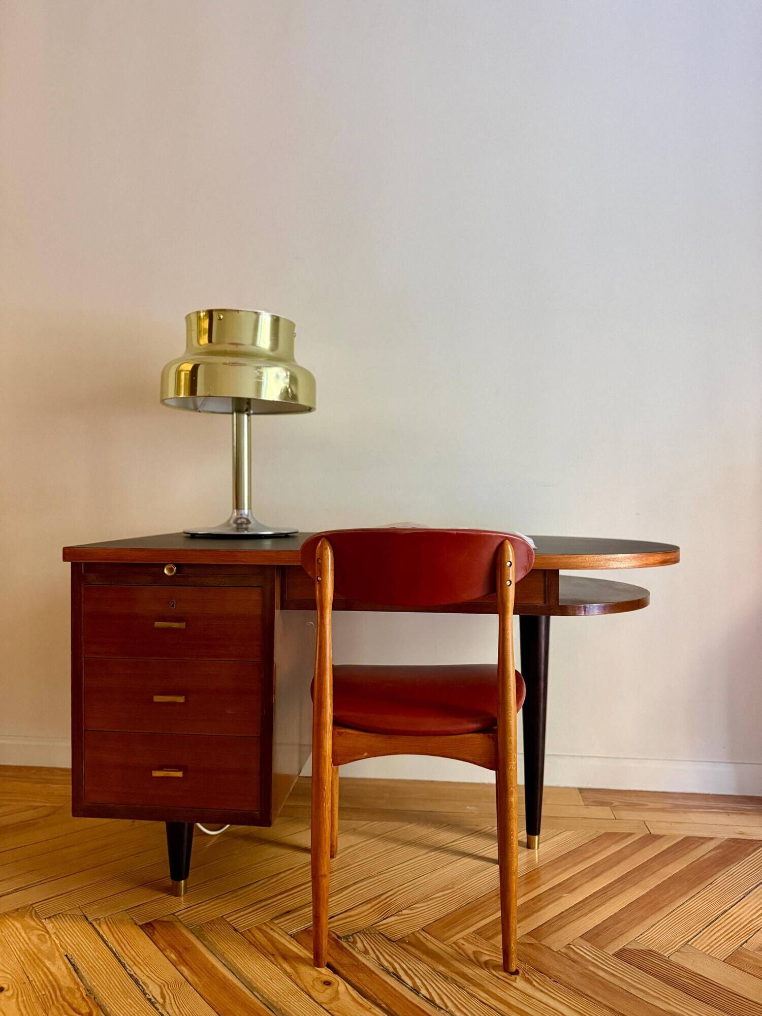 French desk "Prouve" in walnut, bronze and rubber from the 1970s.