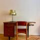 French desk "Prouve" in walnut, bronze and rubber from the 1970s.