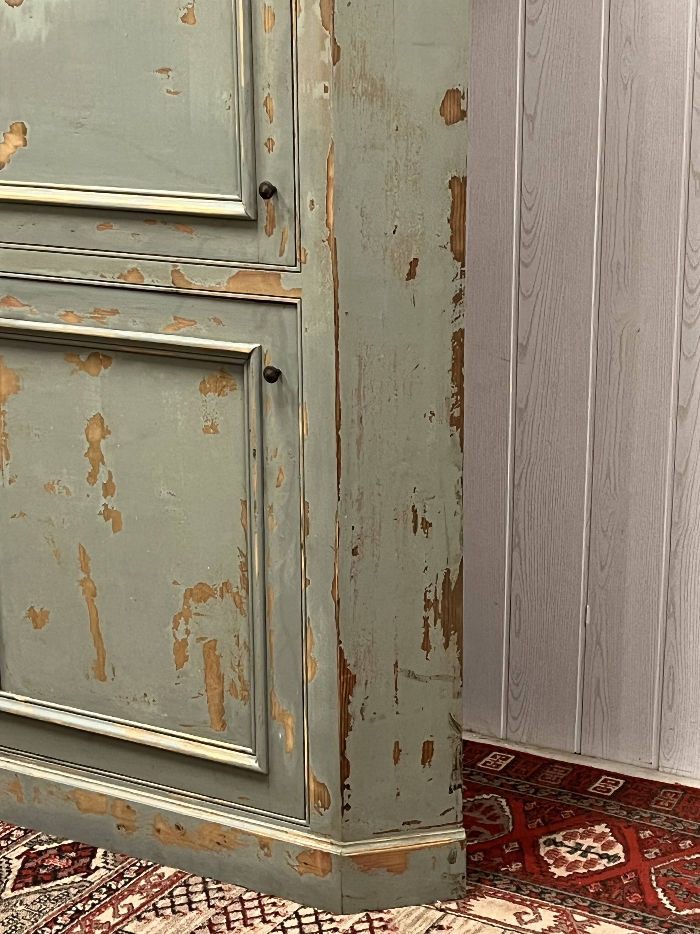 Patinated corner cupboard