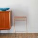 Small brass side table with a teak top, 1960.