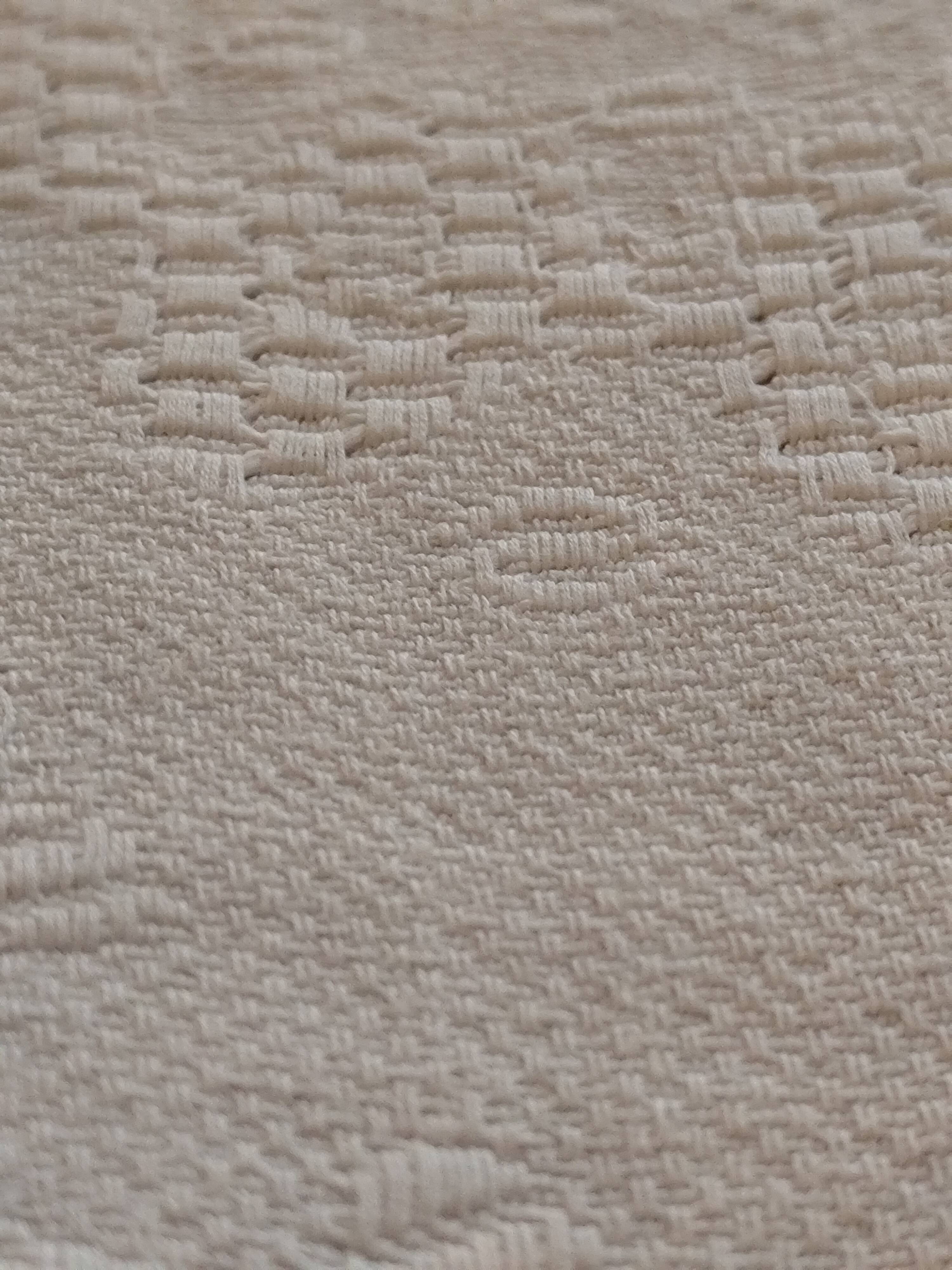 White woven cotton bedspread with fringes