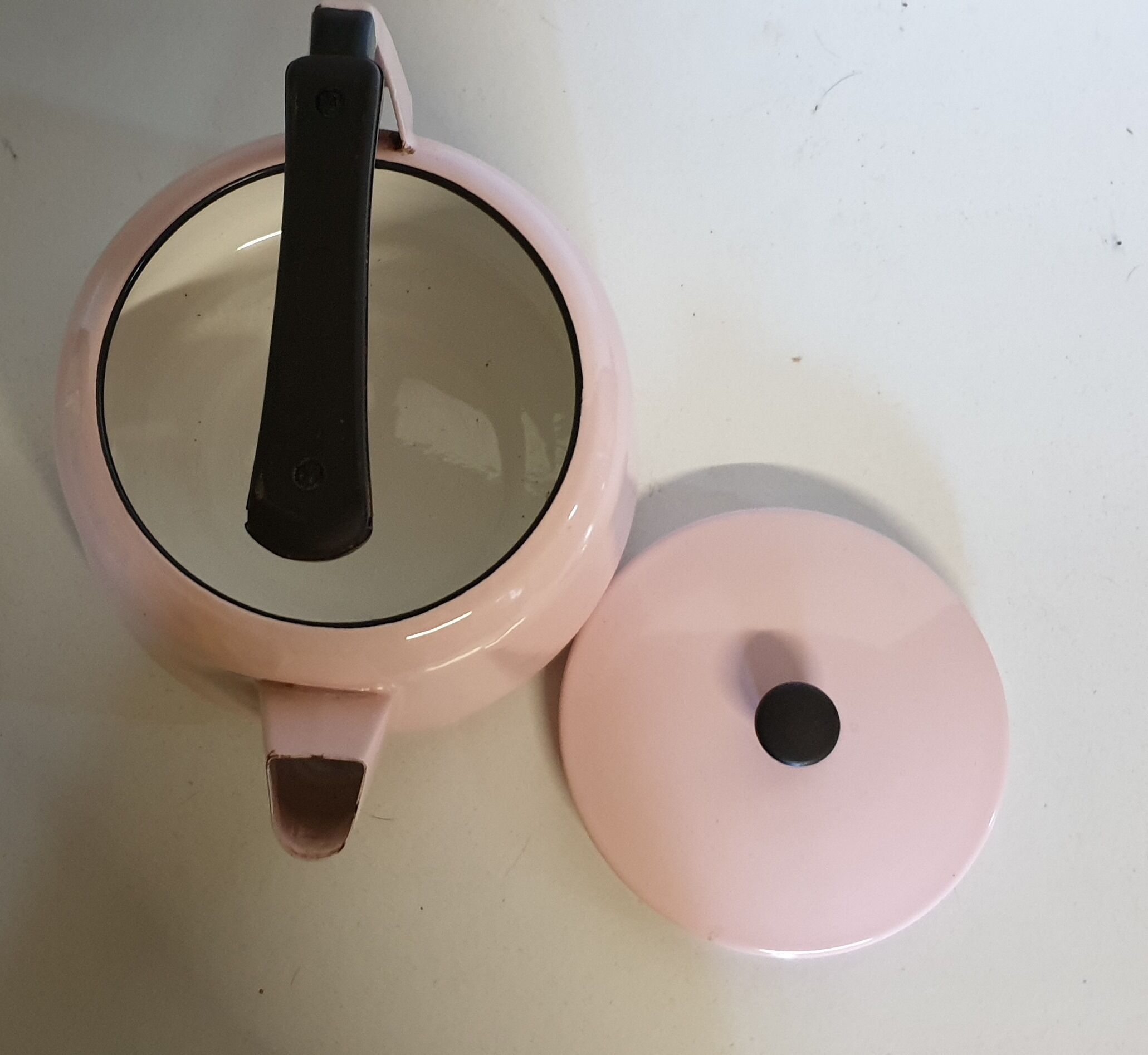 Pink enamelled tin kettle